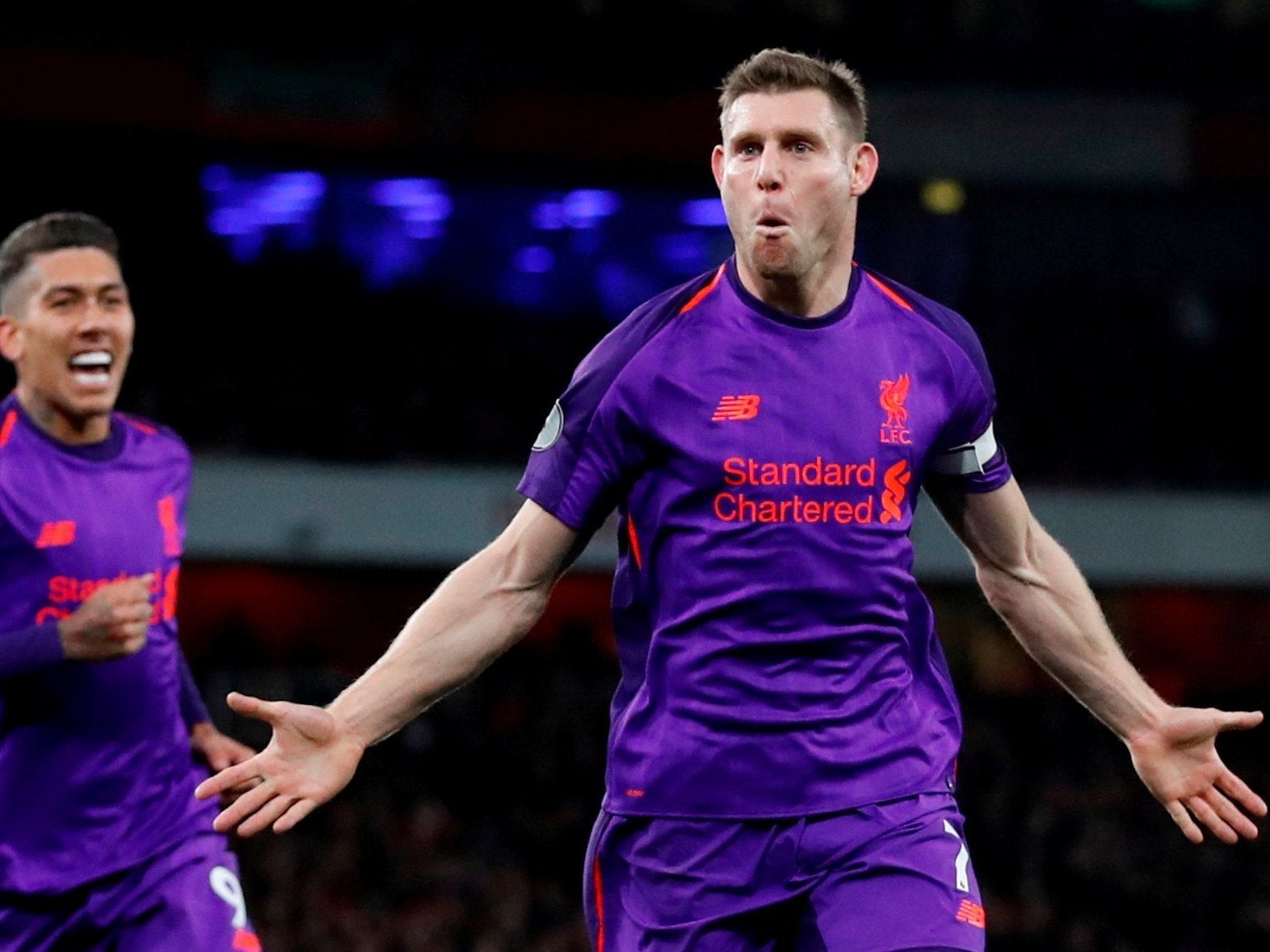 James Milner celebrates after scoring for Liverpool against Arsenal