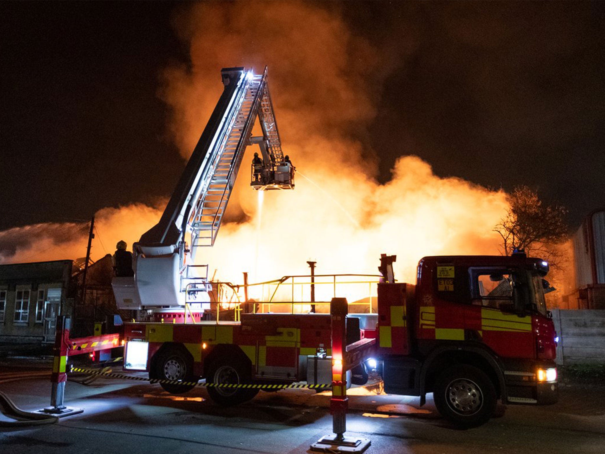 Several gas explosions have taken place during a large fire at a former cattle market in Nottingham