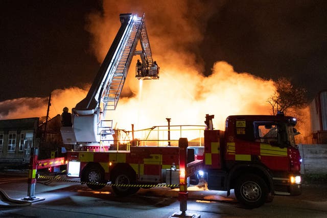 Several gas explosions have taken place during a large fire at a former cattle market in Nottingham