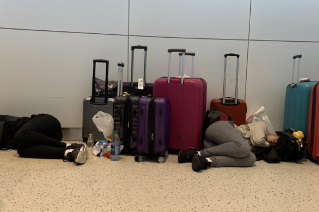 Long night: some passengers on the much-delayed BA flight 2036 were forced to sleep on the floor of New York JFK airport