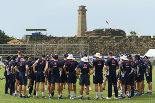 Galle's fort looks over rising stands and England's team meeting