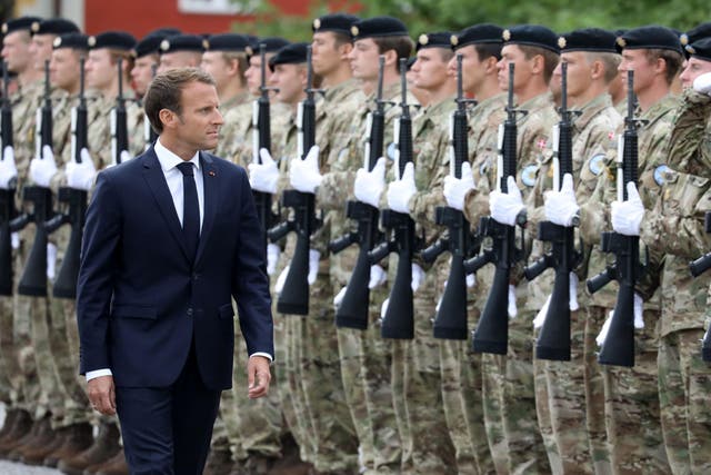 Emmanuel Macron inspects Danish troops on a visit to Denmark in August this year