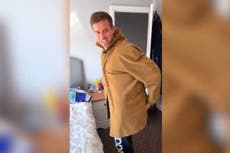 Ryanair passenger cheats new free hand luggage policy with giant coat