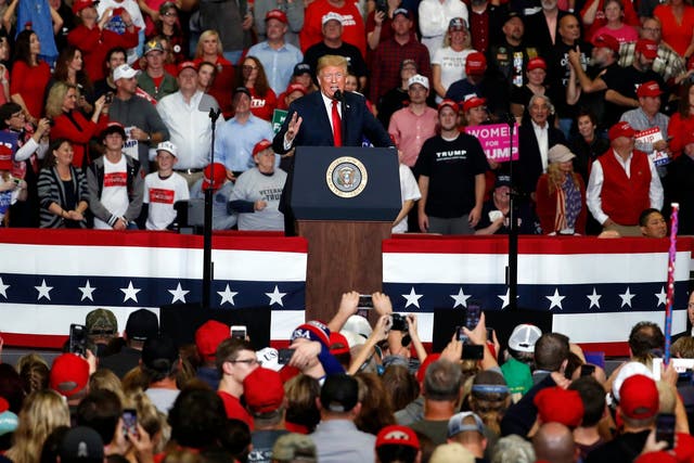 Crowds sang 'Amazing Grace' after a woman collapsed at Donald Trump's rally in Missouri