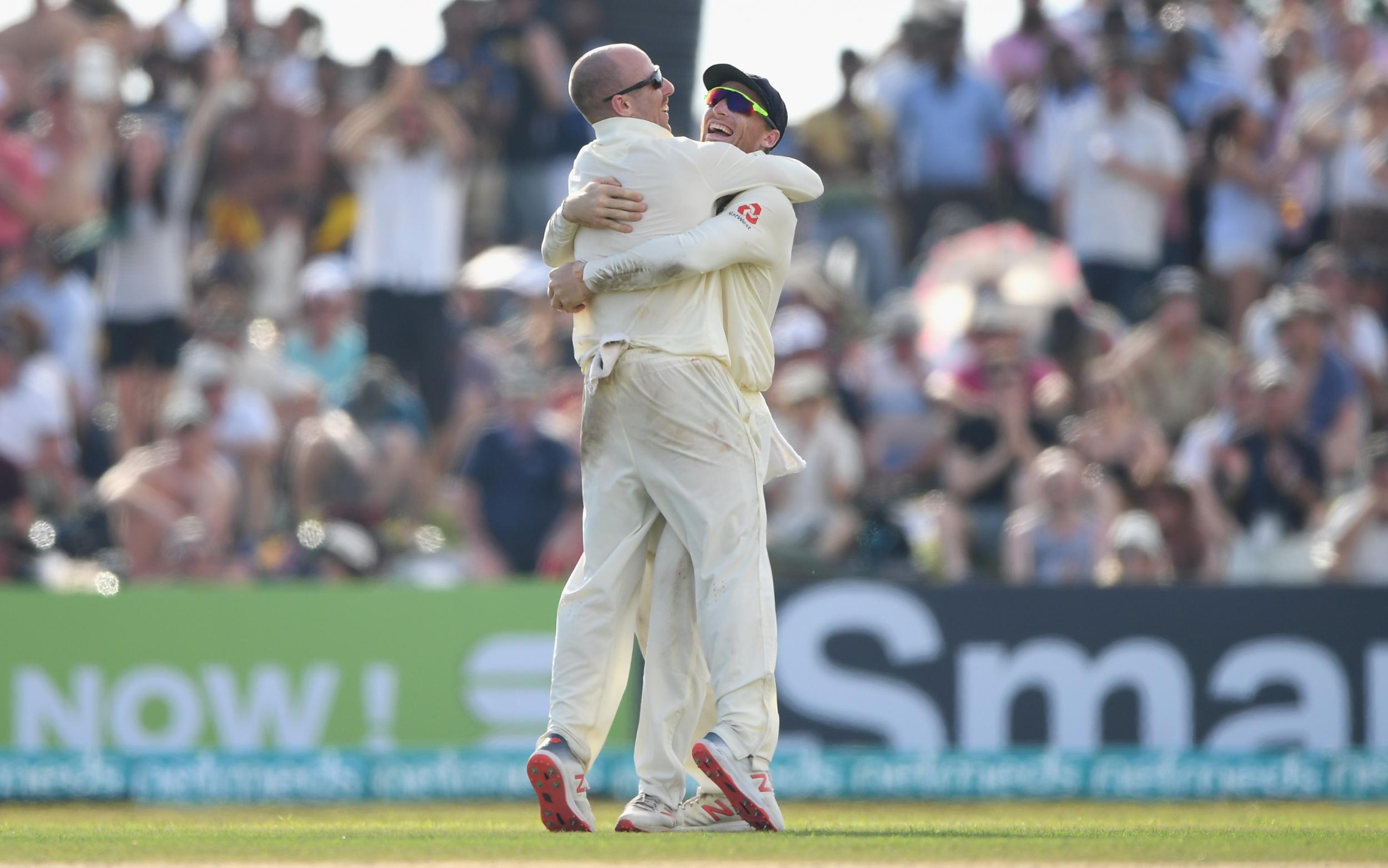 Jack Leach celebrates with Jos Buttler after taking another wicket