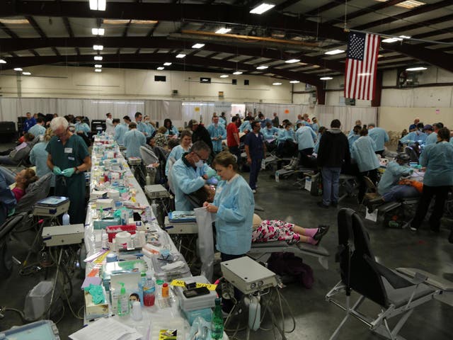 Dentists and nurses treat crowds of patients for free at a pop-up clinic in Tennessee