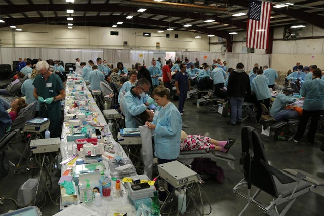 Dentists and nurses treat crowds of patients for free at a pop-up clinic in Tennessee