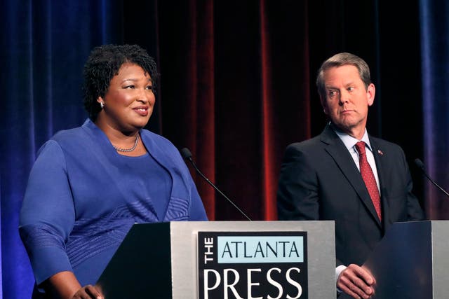 Democratic gubernatorial candidate for Georgia Stacey Abrams, left, speaks as her Republican opponent Secretary of State Brian Kemp looks on during a debate in Atlanta
