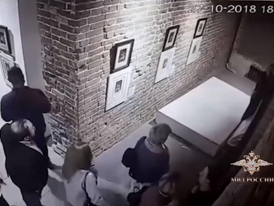 CCTV footage showed a wall displaying a Dali artwork collapsing to the floor