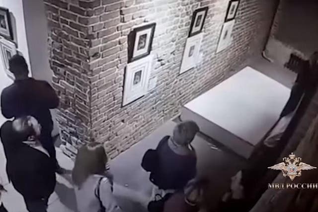 CCTV footage showed a wall displaying a Dali artwork collapsing to the floor