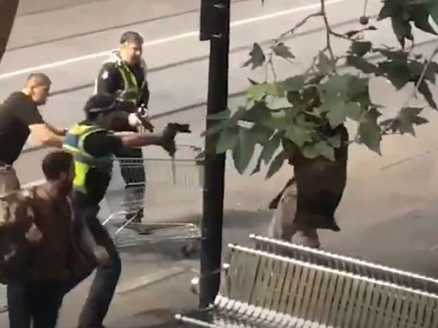 Police in Melbourne shoot a man who was attacking them with a knife