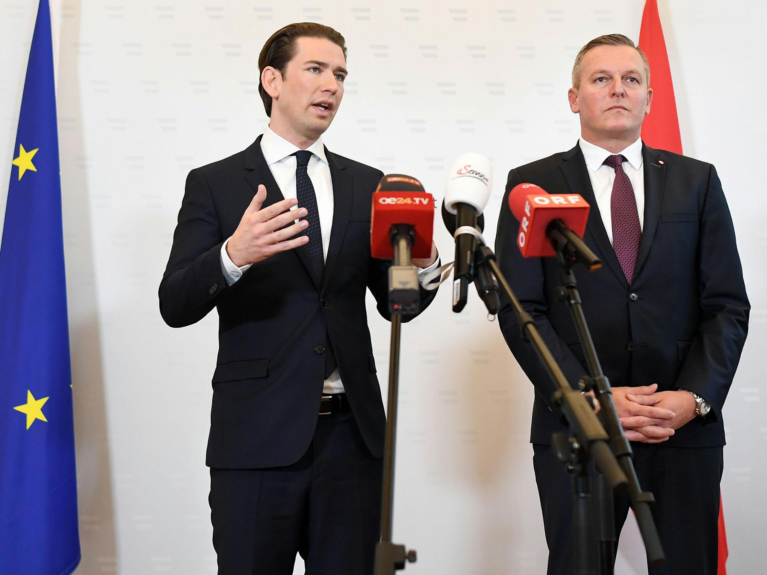 Austrian chancellor Sebastian Kurz (left) and defence minister Mario Kunasek (right) give a press conference in Vienna,