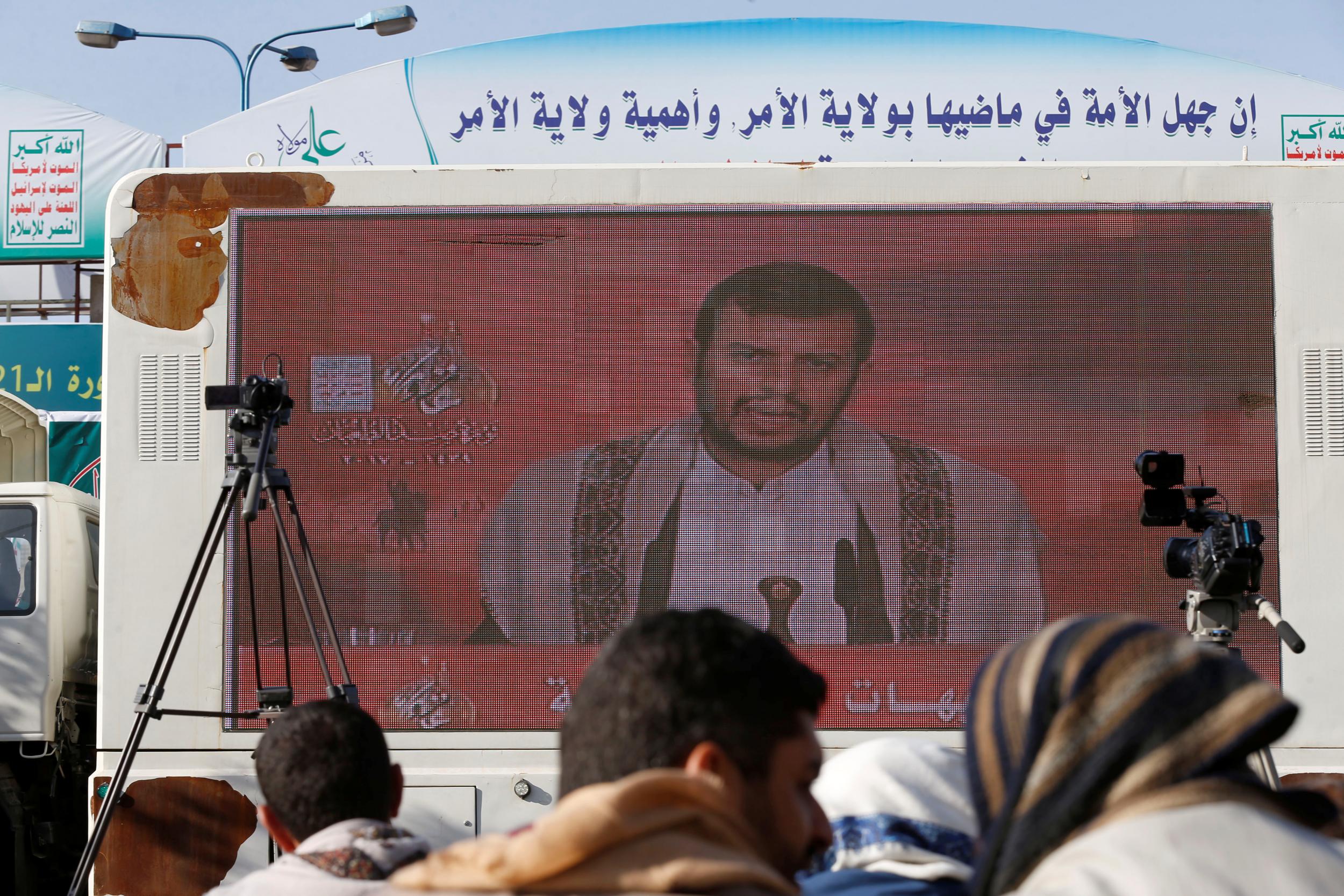 Leader of the Shi’ite Houthi movement, Abdul-Malik Badruddin al-Houthi, addresses supporters via a screen