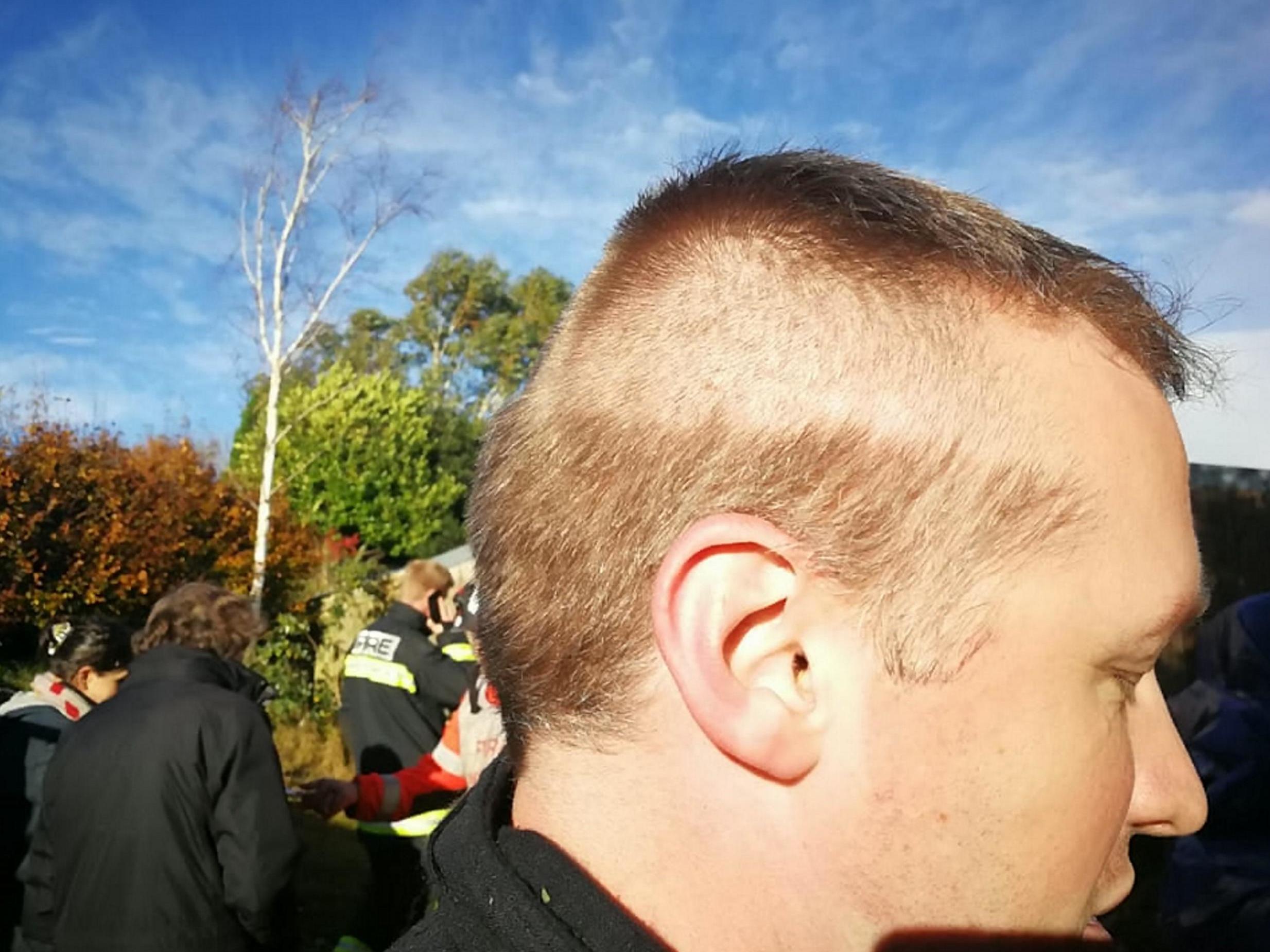 Firefighter responds to emergency with half his head shaved after 999 call  during haircut | The Independent | The Independent
