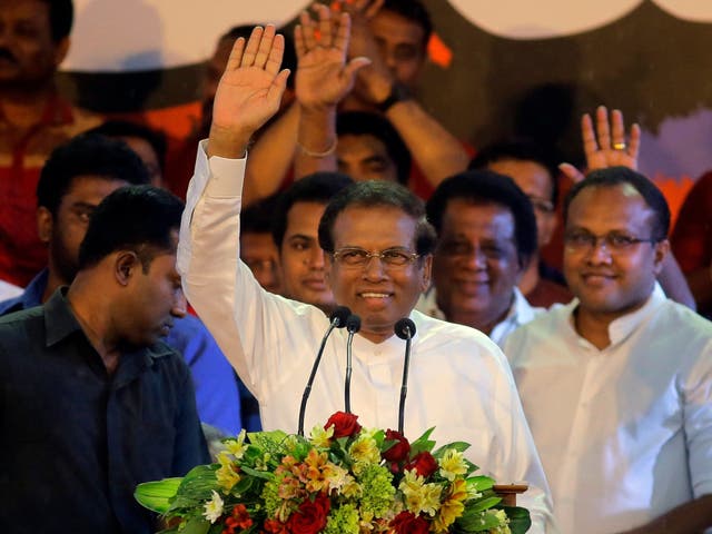 Sri Lankan President Maithripala Sirisena, waves to supporters during a rally outside the parliamentary complex in Colombo, Sri Lanka, on 5 November