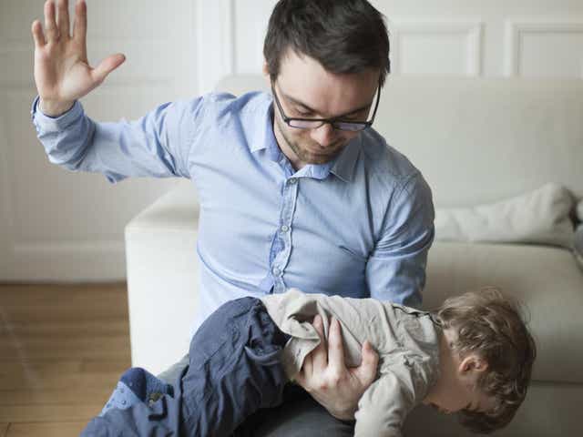 Father disciplining toddler
