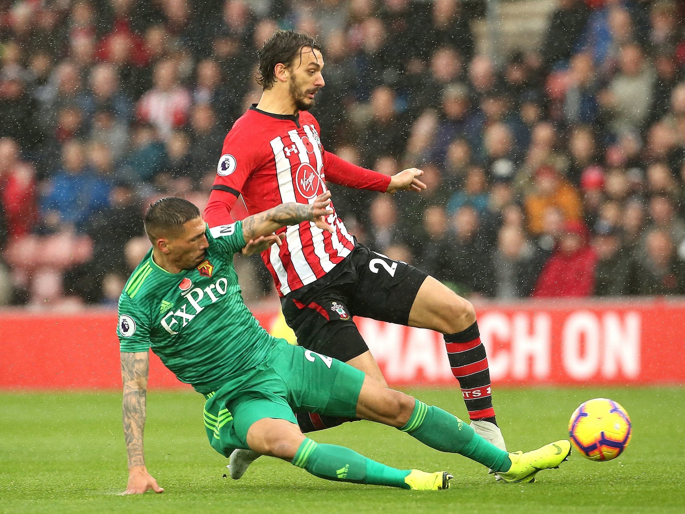 Manolo Gabbiadini is challenged by Jose Holebas