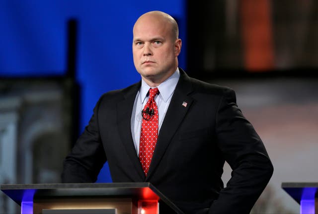 In this April 24, 2014, file photo, Matt Whitaker watches before a live televised debate in Johnston, Iowa