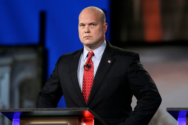 In this April 24, 2014, file photo, Matt Whitaker watches before a live televised debate in Johnston, Iowa