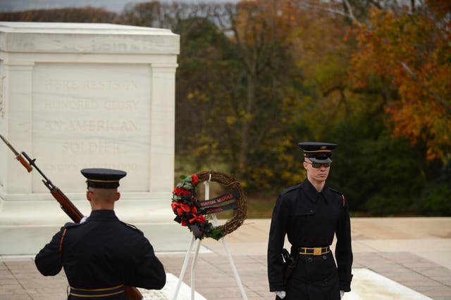Honour guards patrol the Tomb of the Unknown Soldier at Arlington National Cemetery in Arlington, Virginia, on Friday. (Astrid Riecken /