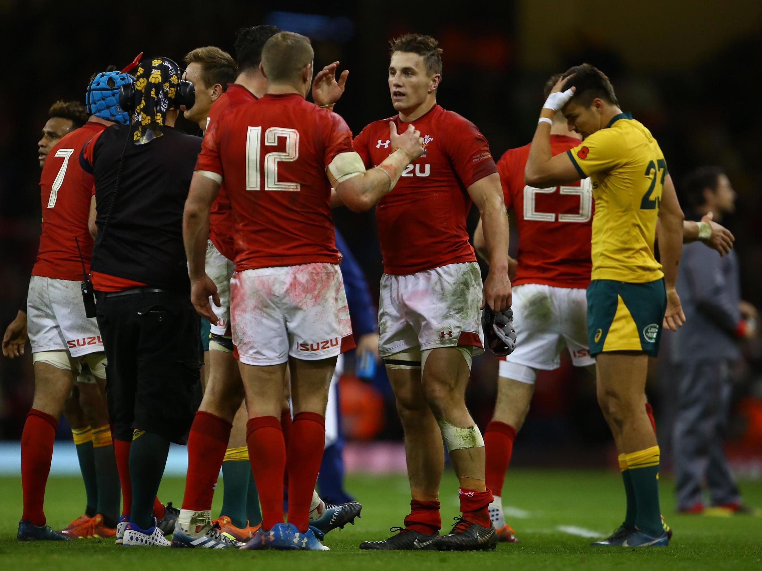 Wales celebrate after securing victory at the Principality Stadium