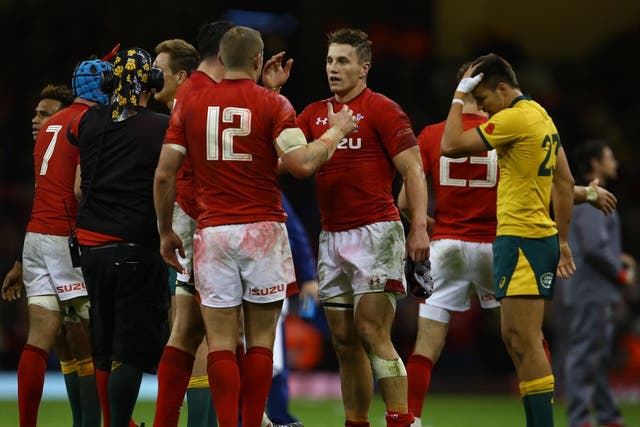 Wales celebrate after securing victory at the Principality Stadium