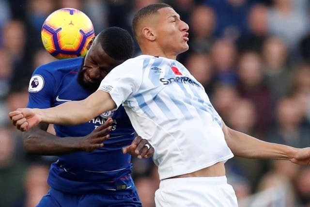 Antonio Rudiger collides with Richarlison as they compete for a header