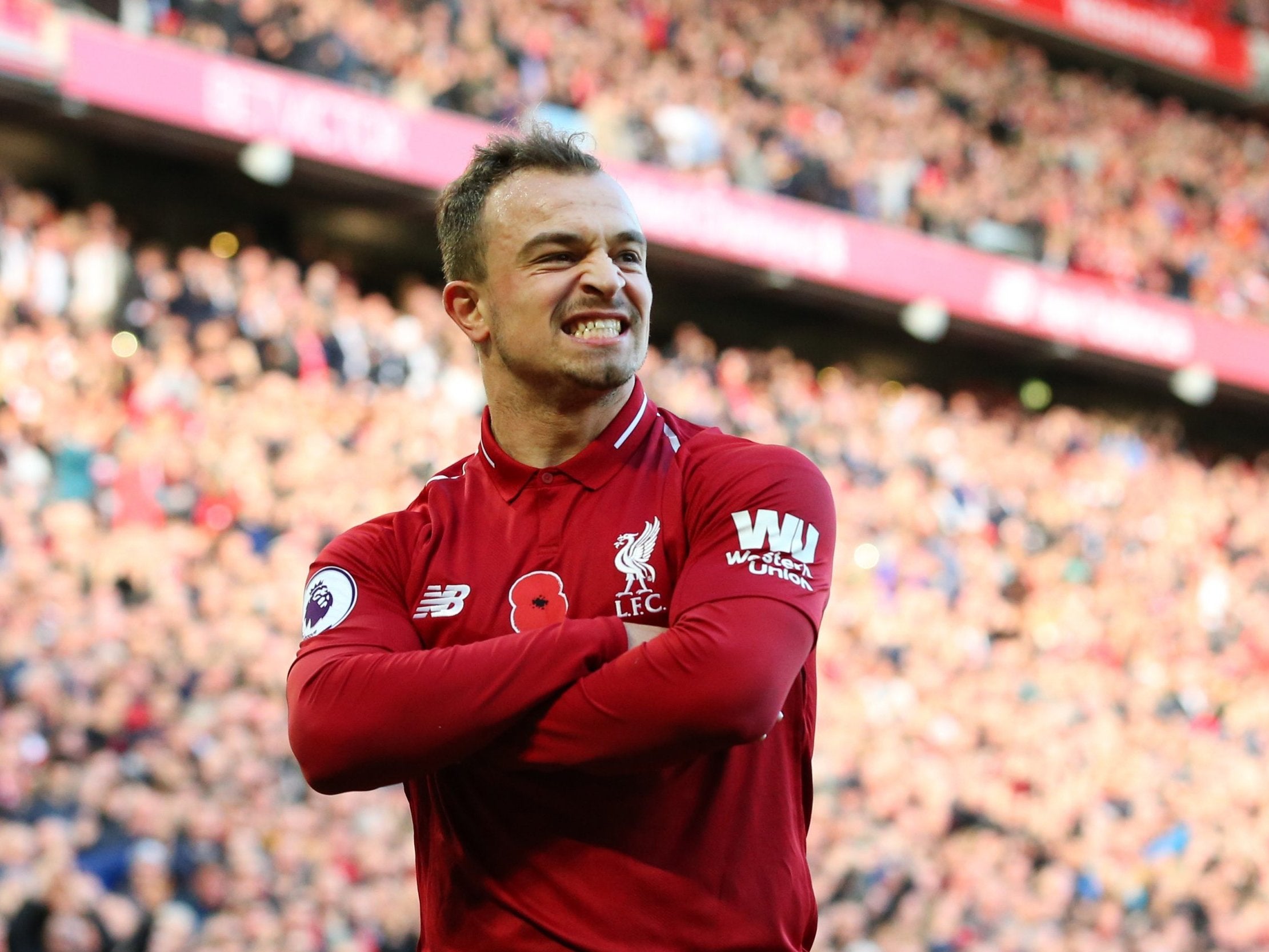 Xherdan Shaqiri celebrates after securing Liverpool's victory over Fulham