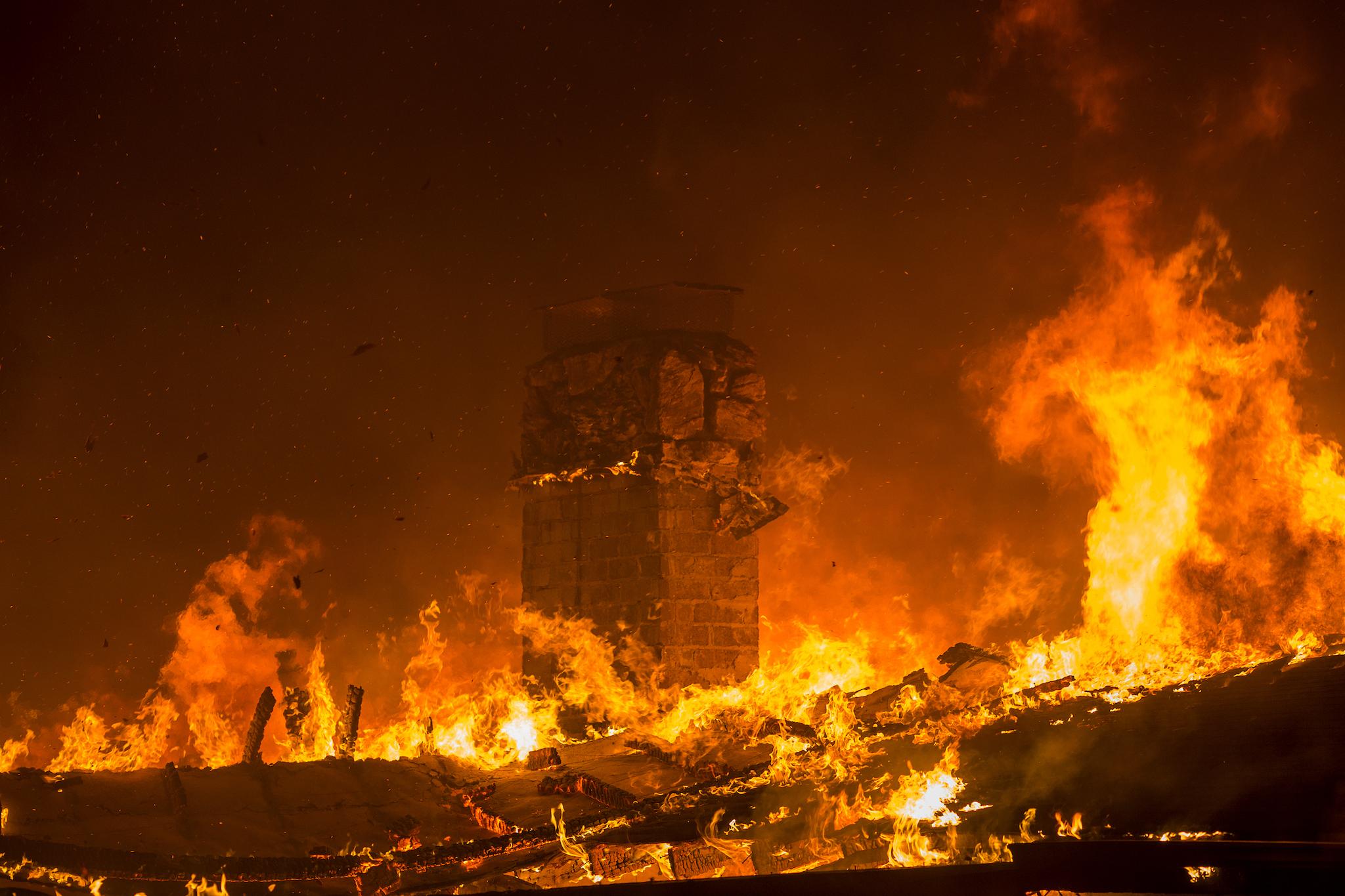 A house burns during the Woolsey Fire on November 9, 2018 in Malibu, California