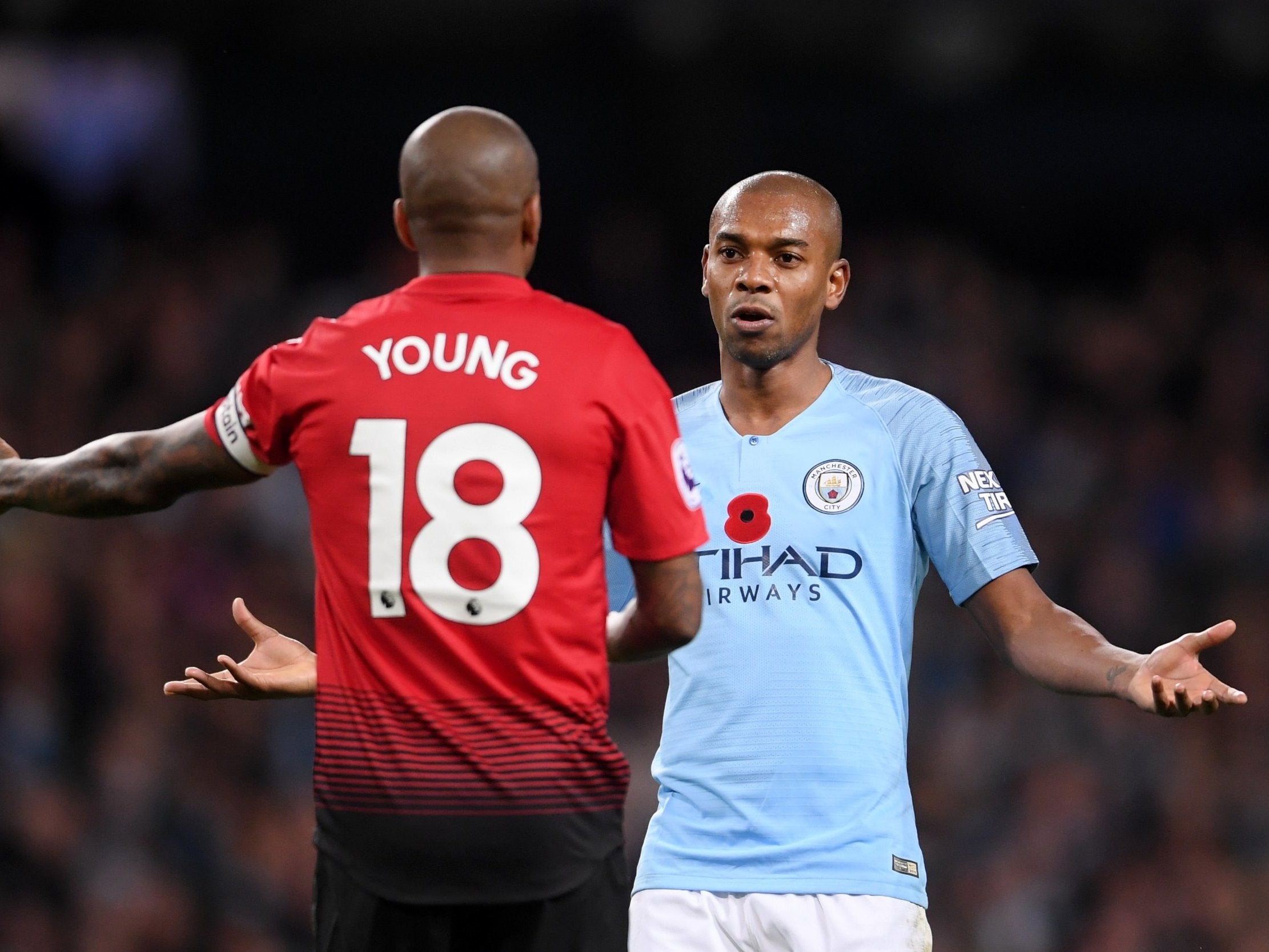 Fernanindho gestures to Ashley Young after shutting down a Manchester United counter attack