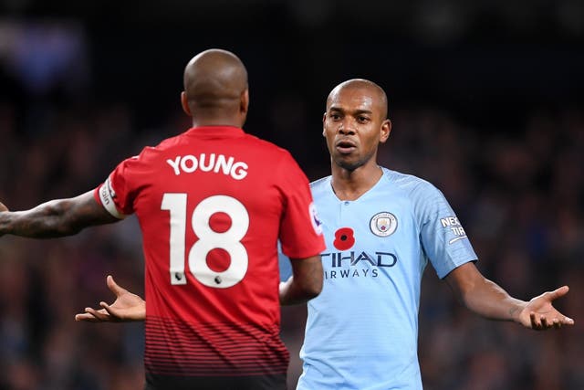 Fernanindho gestures to Ashley Young after shutting down a Manchester United counter attack