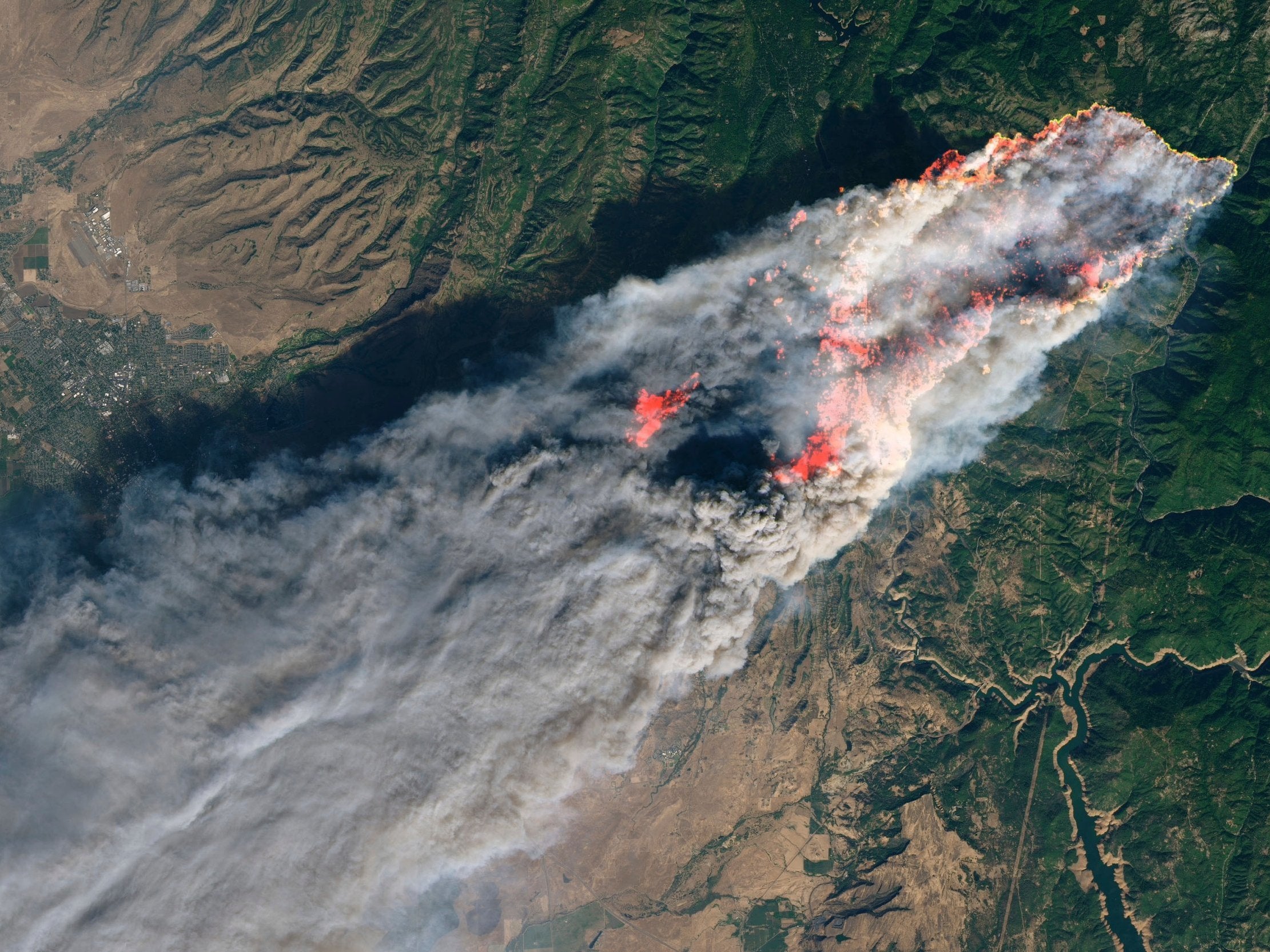 Enhanced satellite image provided by Nasa's Earth Observatory shows the Camp Fire in Paradise, California, on Thursday, 8 November
