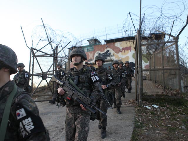 South Korean soldiers leave a border guard post at an undisclosed area in the Demilitarized Zone