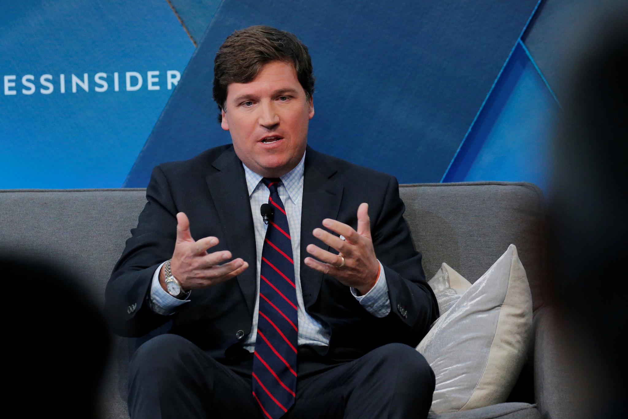 Fox personality Tucker Carlson speaks at a conference in New York