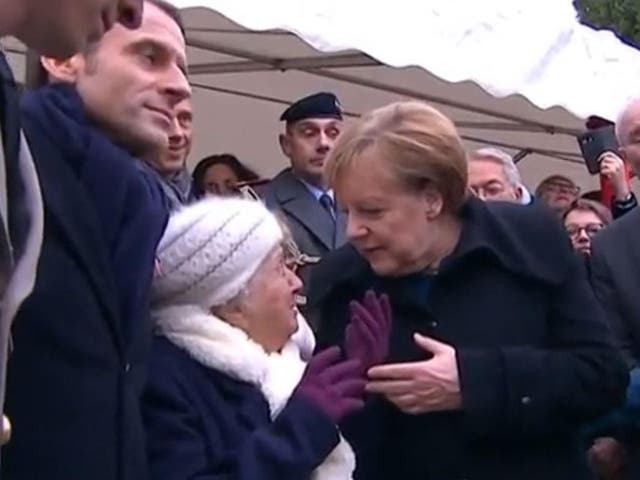 Merkel explains to centenarian that she is not French leader's wife