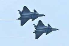 China unveils missiles in J-20 stealth fighter jets 