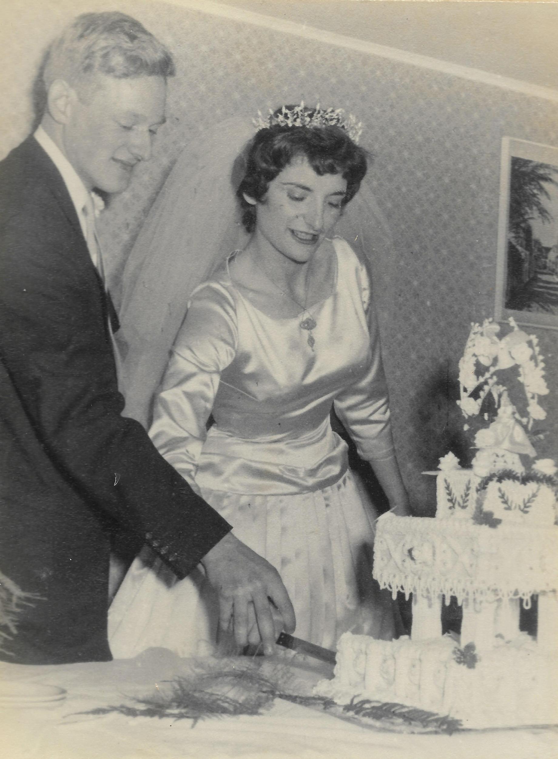 Mike and Cindy cut their wedding cake