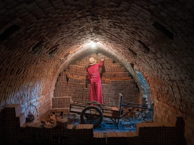 Almost every brick laid in the nation’s urban expansion is fired in kilns where workers languish for years in bondage