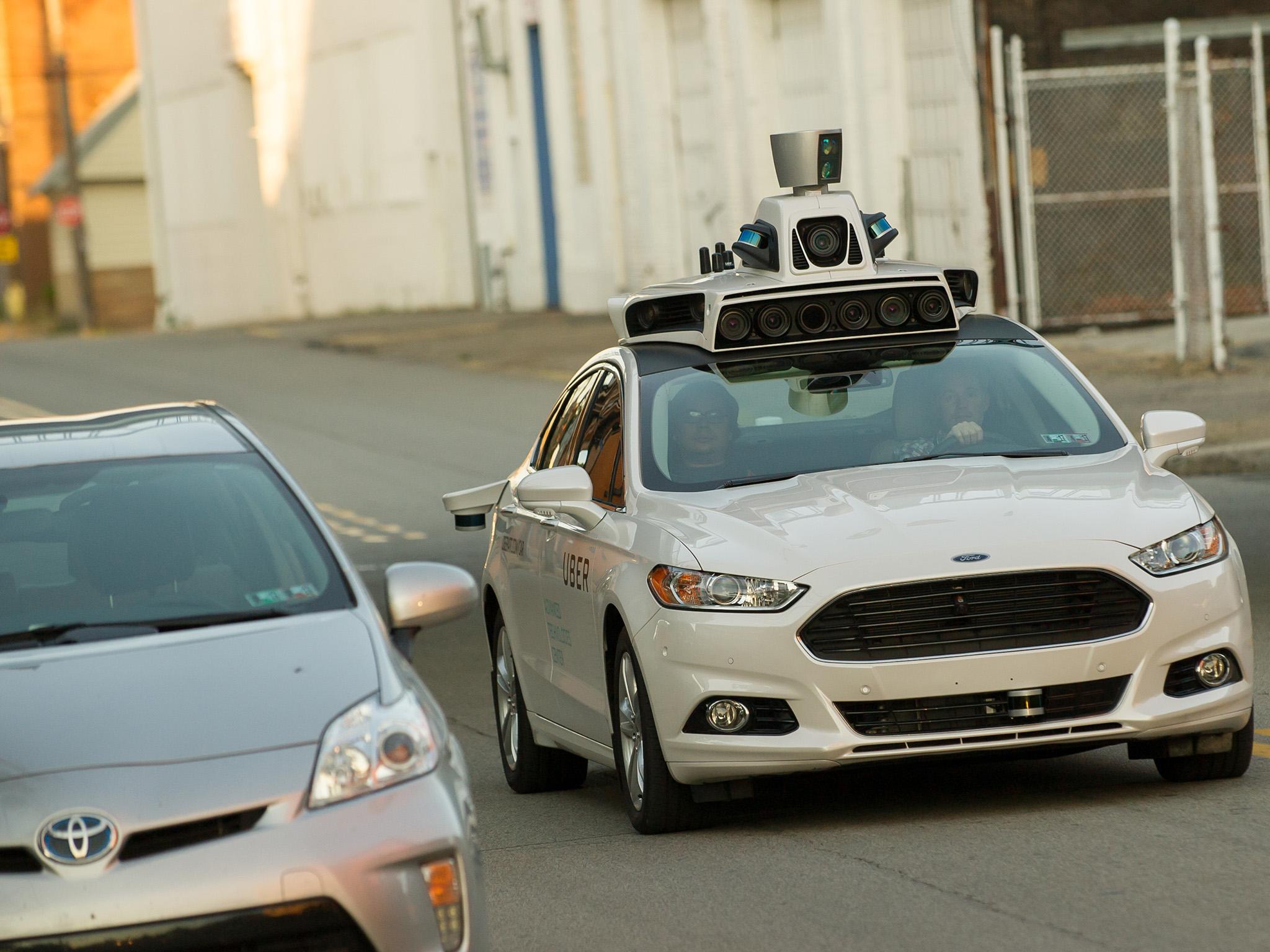 Uber halts driverless testing after death