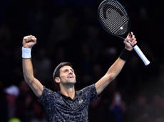 Djokovic eases past Isner to open bid for sixth ATP Finals title