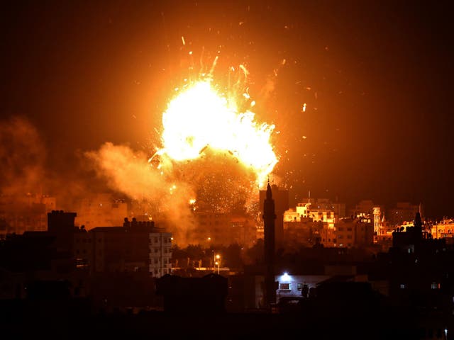 A ball of fire rises above the building housing the Hamas-run television station al-Aqsa TV in Gaza City on Monday