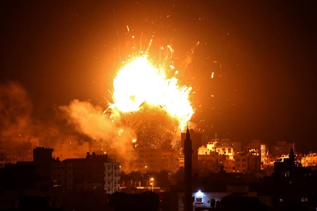 A ball of fire rises above the building housing the Hamas-run television station al-Aqsa TV in Gaza City on Monday