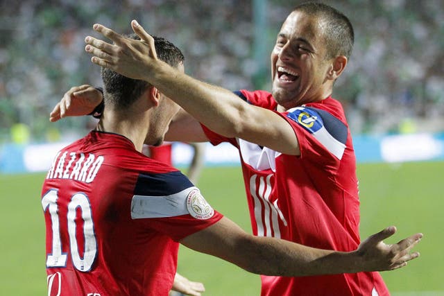 Lille's Eden Hazard celebrates with teammate Joe Cole
