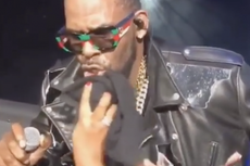 R Kelly seen in clip letting fans wipe his sweat and paw at his crotch