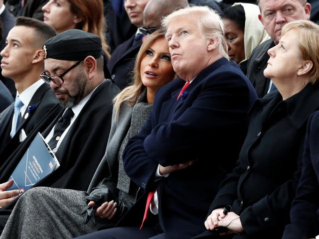 Donald and Melania Trump sat in between the King of Morocco and chancellor Angela Merkel at the Arc de Triomphe in Paris