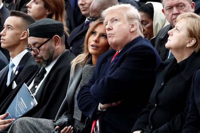 Donald and Melania Trump sat in between the King of Morocco and chancellor Angela Merkel at the Arc de Triomphe in Paris