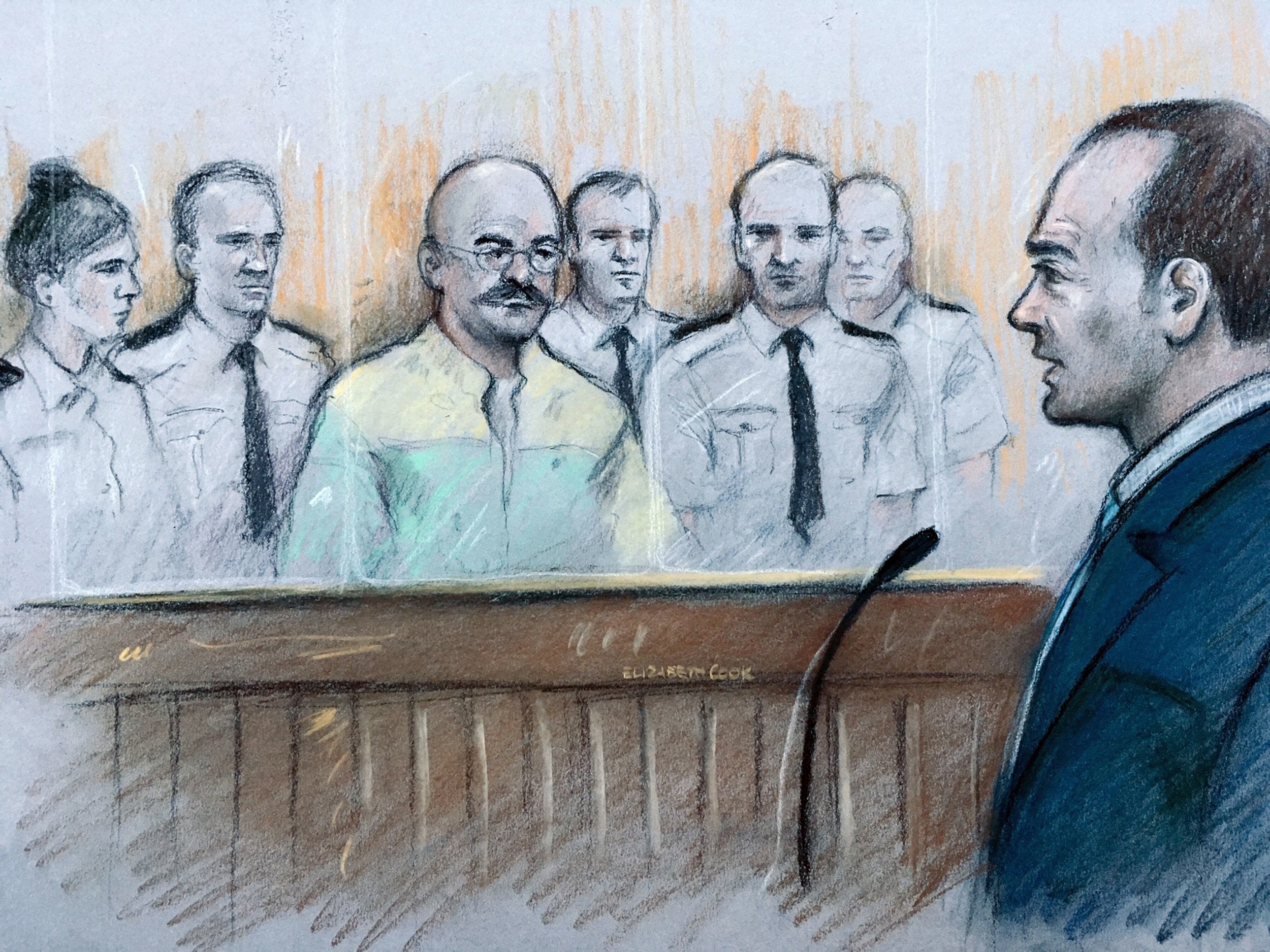 A court artist sketch of Charles Bronson listening as prison governor Mark Docherty gives evidence at Leeds Crown Court