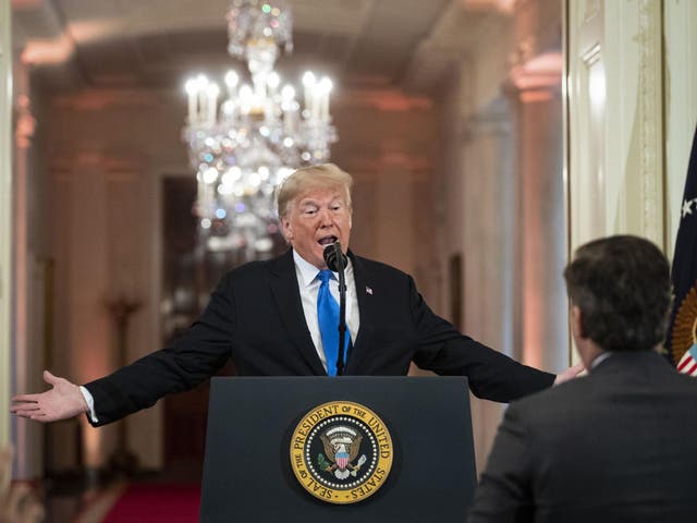 US President Donald Trump gets into an exchange with CNN reporter Jim Acosta during a news conference a day after the midterm elections on November 7, 2018 (Al Drago - Pool