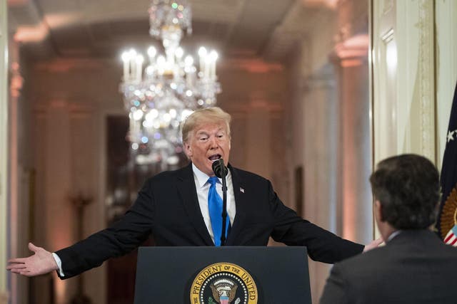 US President Donald Trump gets into an exchange with CNN reporter Jim Acosta during a news conference a day after the midterm elections on November 7, 2018 (Al Drago - Pool