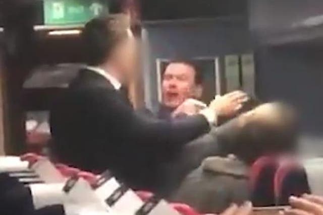 A man was filmed hurling racist abuse at an Asian couple aboard a train in Bristol.